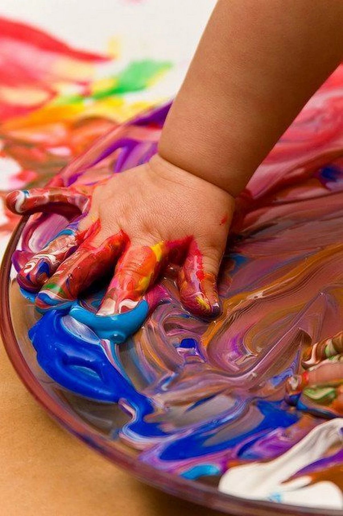 Child finger painting at WAWAS